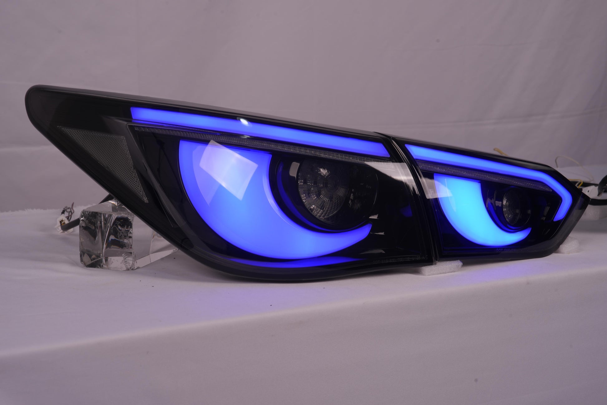 Infiniti Q50 Hawkeye style RGB tail lights blue close up